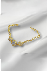 Golden Bracelet on white surface