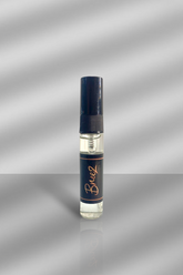 Breeze Small perfume bottle with a blue label on a gray background