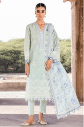 Woman wearing a light green traditional outfit with a matching dupatta in an outdoor setting.