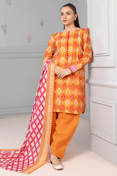 Woman wearing an orange and red traditional outfit with a pink and white dupatta against a gray wall.