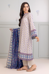 Woman wearing a white and blue patterned kurta with a matching dupatta on a plain background