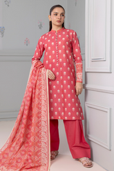 Woman wearing a pink traditional outfit with a matching dupatta against a light gray wall.