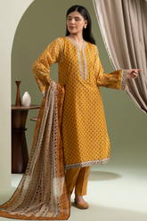 Woman wearing a mustard yellow traditional outfit with a matching dupatta in a minimalistic setting.