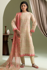 Woman wearing a traditional outfit with a pink dupatta in a minimalistic setting
