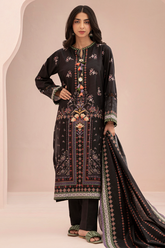 Woman wearing a black embroidered traditional outfit with a beige background