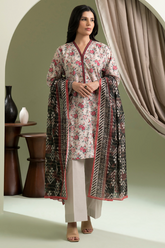 Woman wearing a floral kurta with a patterned dupatta in a minimalistic setting.