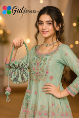 A girl in a light green embroidered outfit holding a matching bag, with 'Gulwears' branding.