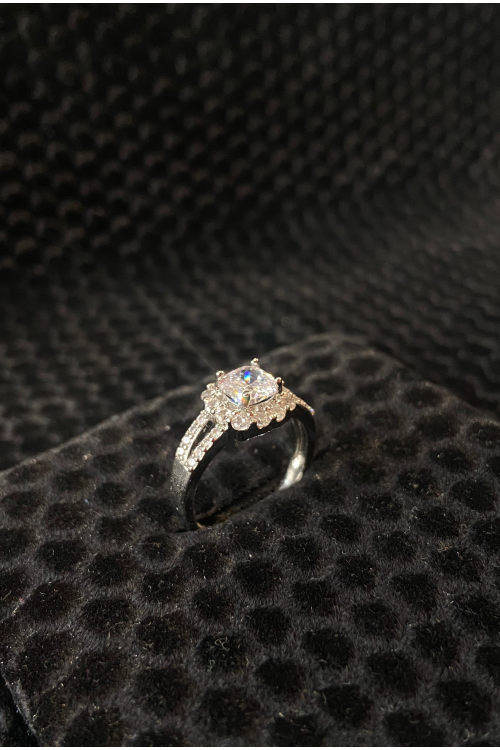 Diamond ring on a black textured surface