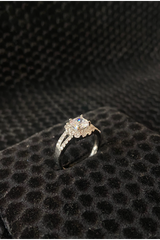 Diamond ring on a black textured surface