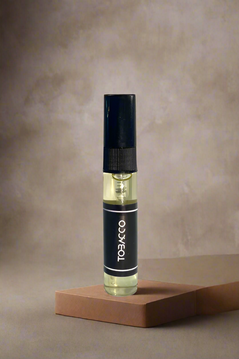 Vape pen with 'Tobacco' label on a metallic background