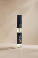 Breeze small perfume bottle with a blue label on a gray background