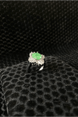 Ring with a green gemstone 
