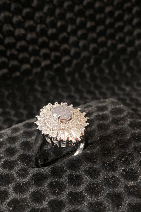 Diamond ring on a textured black surface