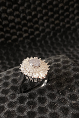 Diamond ring on a textured black surface
