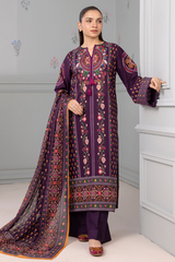 Woman wearing a traditional embroidered outfit with a purple theme in a minimalistic setting.
