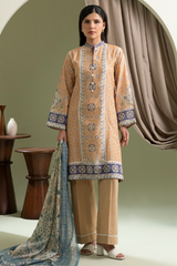Woman wearing a traditional outfit with intricate patterns in a room with decorative elements.