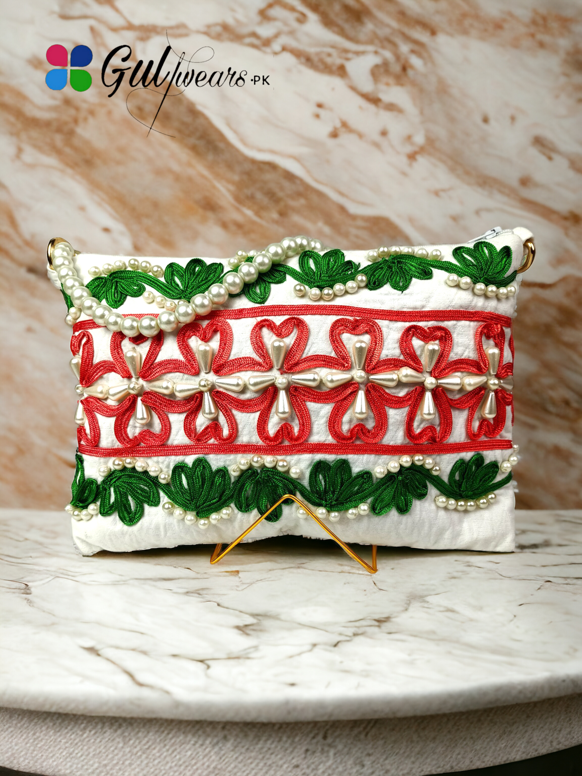 Decent White Ribbon Work Clutch Bag placed on a marble piece.