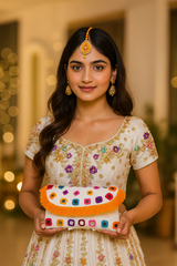 Woman holding a colorful clutch with a blurred background